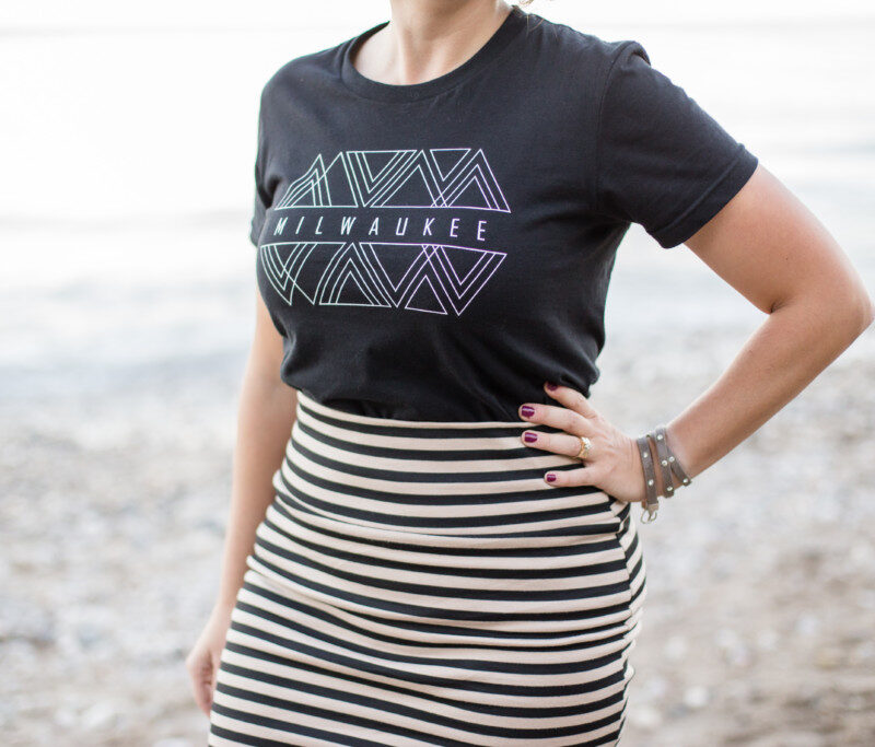 young woman wearing a tshirt that says milwaukee on it