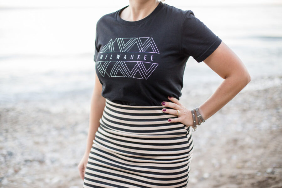 young woman wearing a tshirt that says milwaukee on it