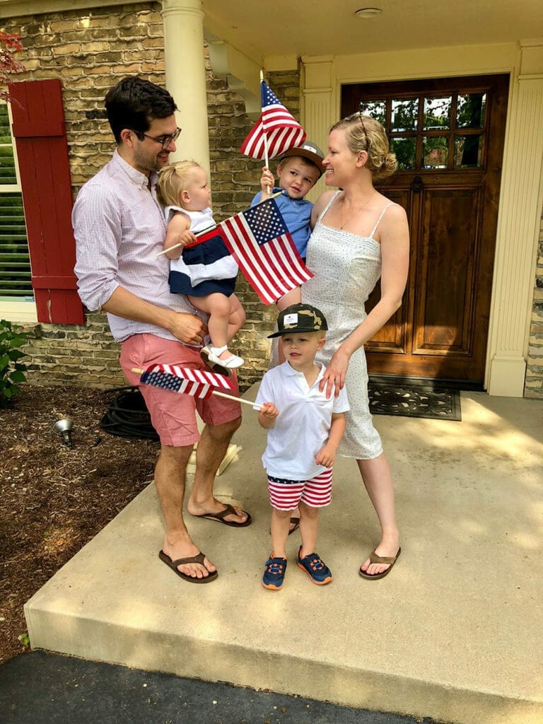 Dr Daniel Butz and his family lauging and playing on the fourth of july