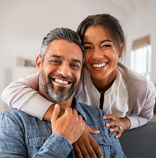 Couple smiling from the benefits of hormone therapy at Quintessa in Mequon.