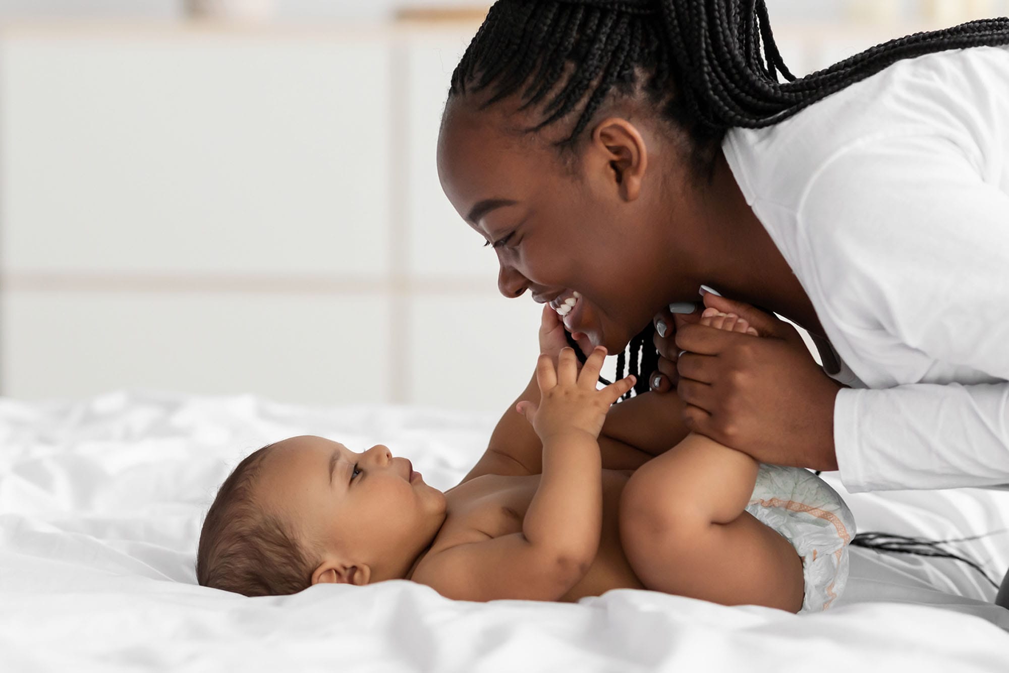 woman and her baby after her mommy makeover after her c-section in Milwaukee, WI