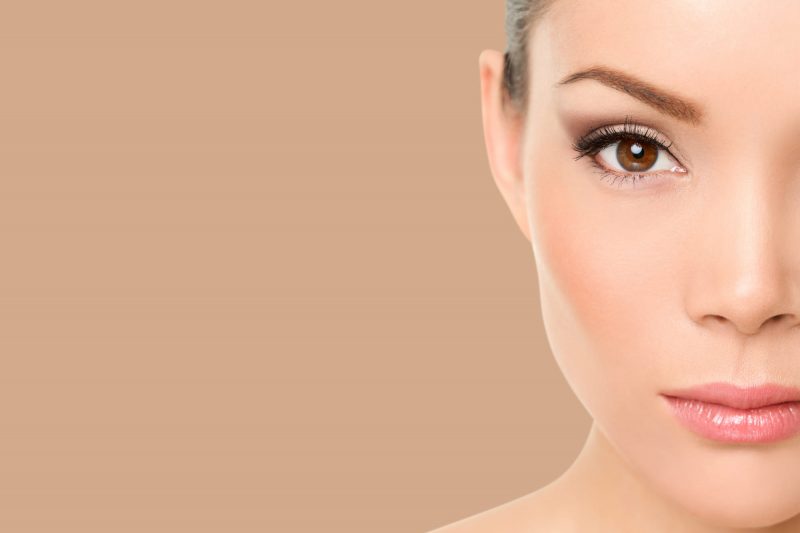 Close-up of refined facial features showcasing natural-looking surgical enhancement and skin rejuvenation.